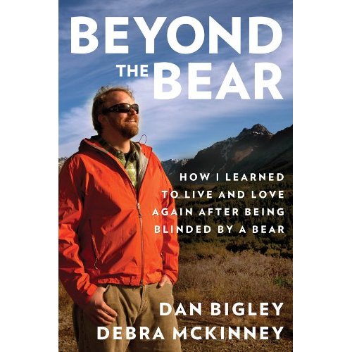 book cover for Beyond the Bear featuring Dan Bigley smiling, standing under a blue sky, in front of mountains.