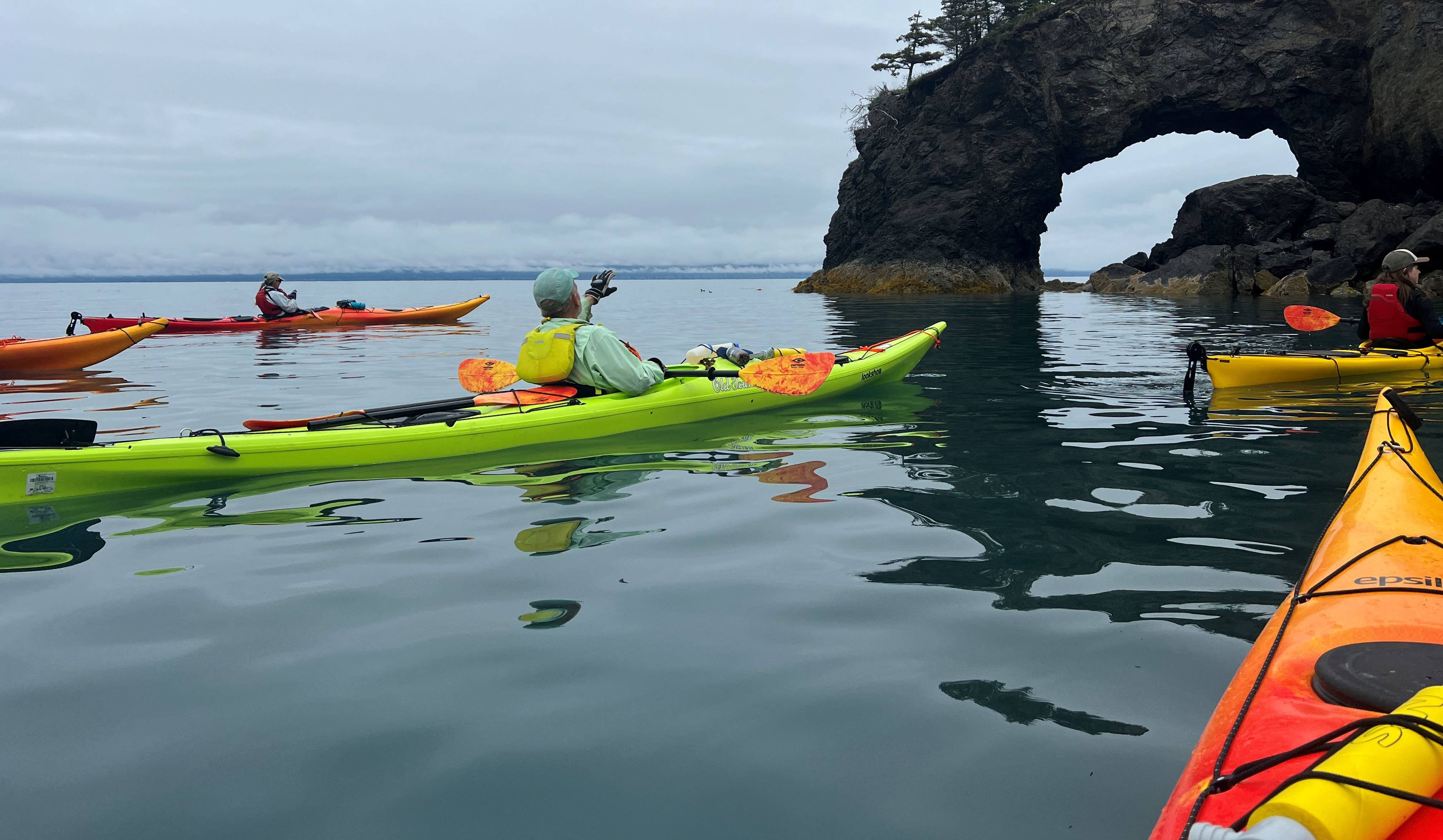 kayakers looking at a geologic feature on the Bay