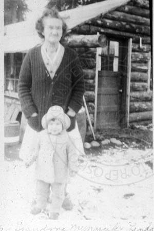Frances Mynarcik and Linda Farnsworth in front of Jack Irons' cabin, Soldotna 1949