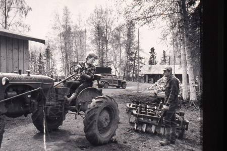 Larry and Rusty (Lorraine) Lancashire and their cabin, Soldotna 1950