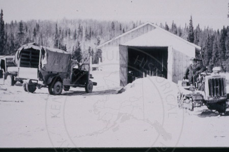 Burton Carver on tractor at Mile 0.5 Sterling Highway, Soldotna 1950