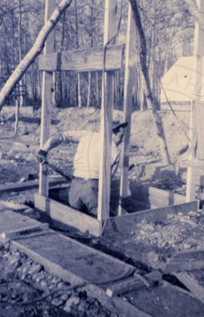 Jack Farnsworth digging a well at the Farnsworth house site, Soldotna 1949