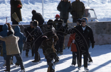 Jean Brockel ice skating with children at the Soldotna Elementary ice rink, Soldotna 1972