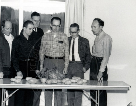 Potato inspection with Jack Farnsworth, borough mayor Harold Pomeroy, and Harold Jackson, Soldotna late 1950's