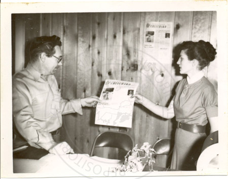 Dorothy Stewart with Al Lee purchasing first copy of the Cheechako News, Soldotna 1960's