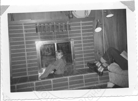 Melanie Back on Carver home fireplace, Soldotna early 1960's