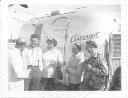 Airstream travelers being greeted, Kenai 1960