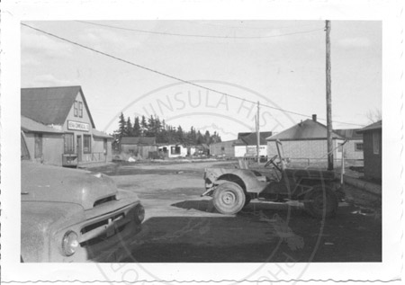 Mission street and view of Showalter family home, Kenai 1955