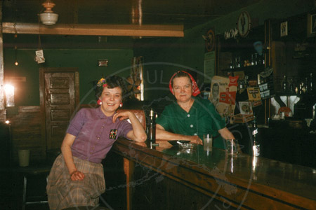 Inside the Moose River Bar with bartender and customer, Sterling 1950's