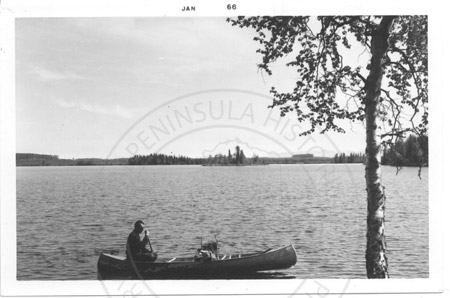 Averill Thayer in his canoe at the Swan Lake canoe system, Kenai Peninsula 1966