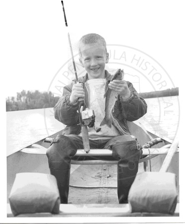 Young Eric Troyer with freshly caught rainbow trout at Gavia Lake, Kenai Peninsula 1960's