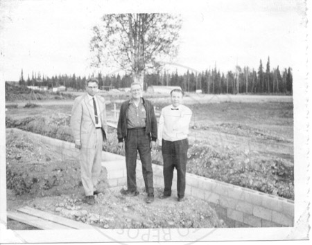 Dick Hall, Ed Rehder, and Larry Famen at the foundation site for the Homer Electric Association plant, Soldotna 1963