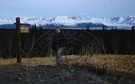 Dave Remley posing in front of Grewingk Glacier, Homer 1956