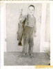 Young Joe Byrd holding a salmon, Soldotna 1961