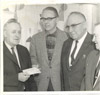 Frank Peratrovich presenting a federal check to Governor Bill Egan, Juneau 1960
