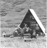 Two horse riders from U.S Forest Service at a cabin in Devil's Pass, Resurrection Trail, Kenai Peninsula 1960
