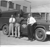 Richard Molnar, Bob Reis, and Eddie Mallete posing with Kenai telephone truck, Kenai/Soldotna early 1960's