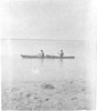 Two men in a bidarka canoe, Prince William Sound 1895-1903