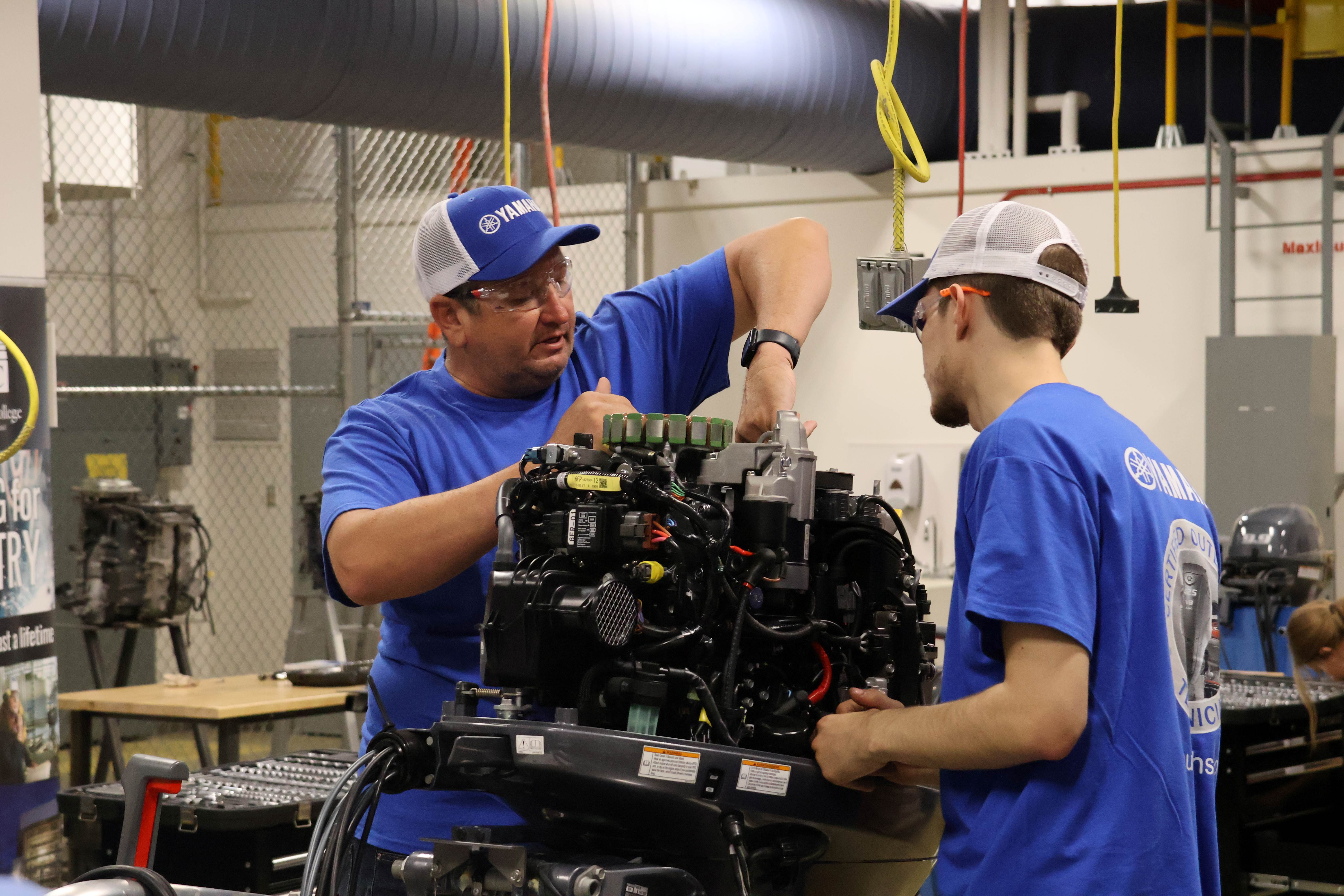 two men working on a motor