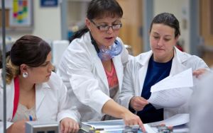 Three women in chemistry lab