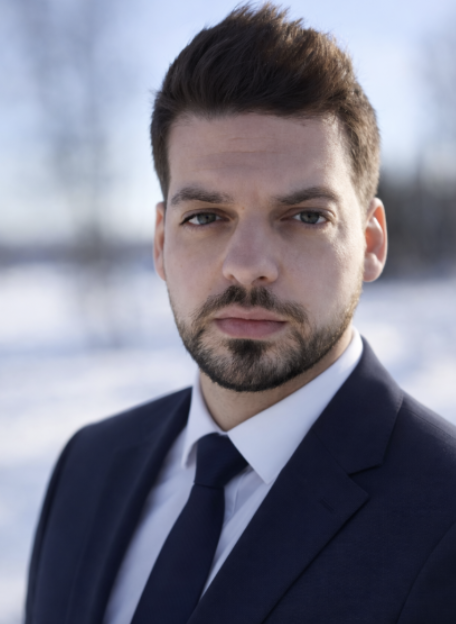 Headshot of man Diego Zelaya, wearing a dark suit