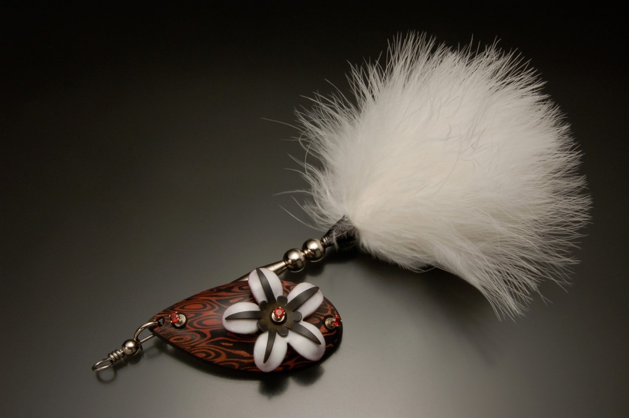 Handmade lure with a flower and white fur